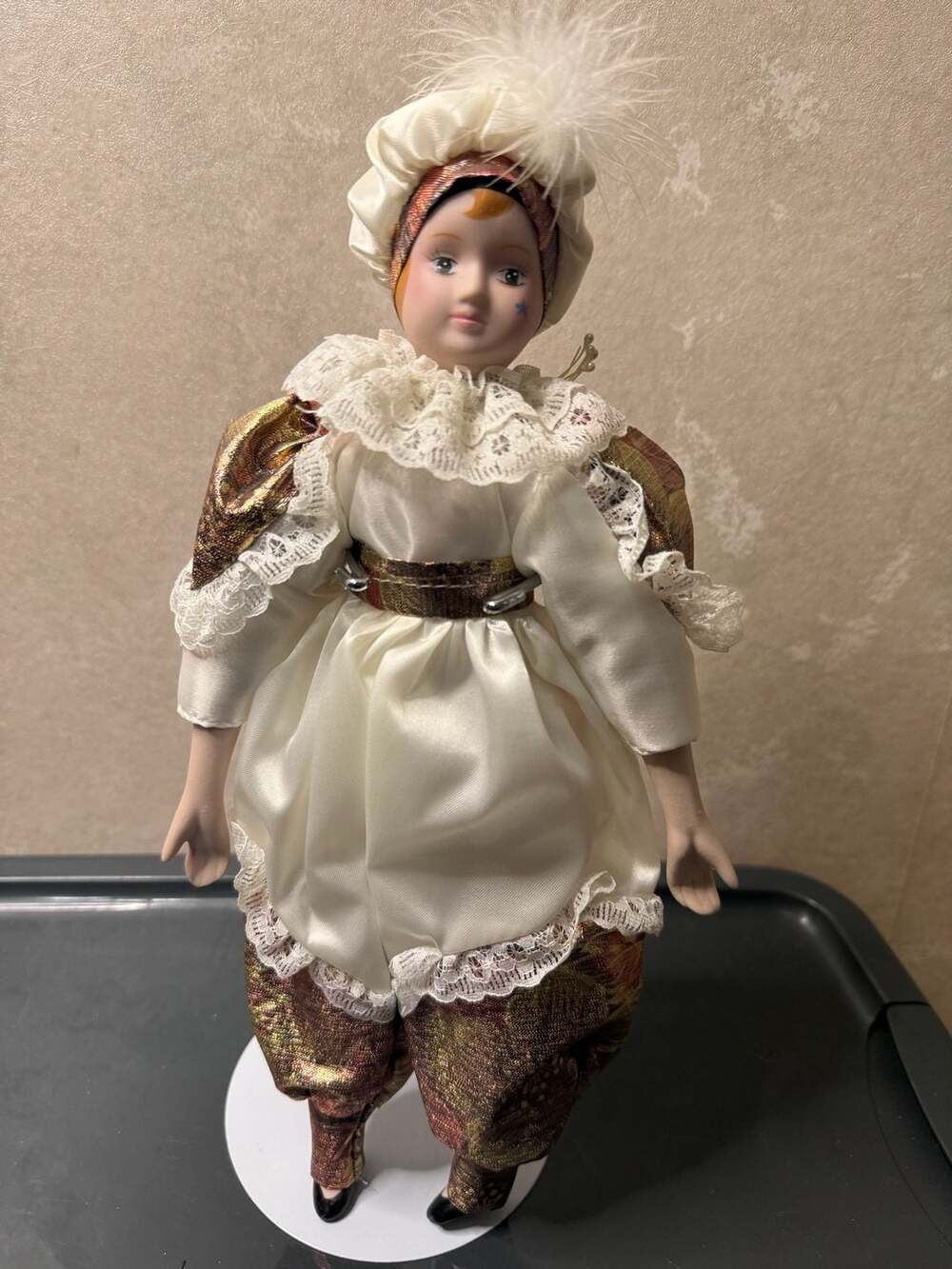 Vintage Porcelain Jester Doll 13 Inch White and Gold Costume With Stand